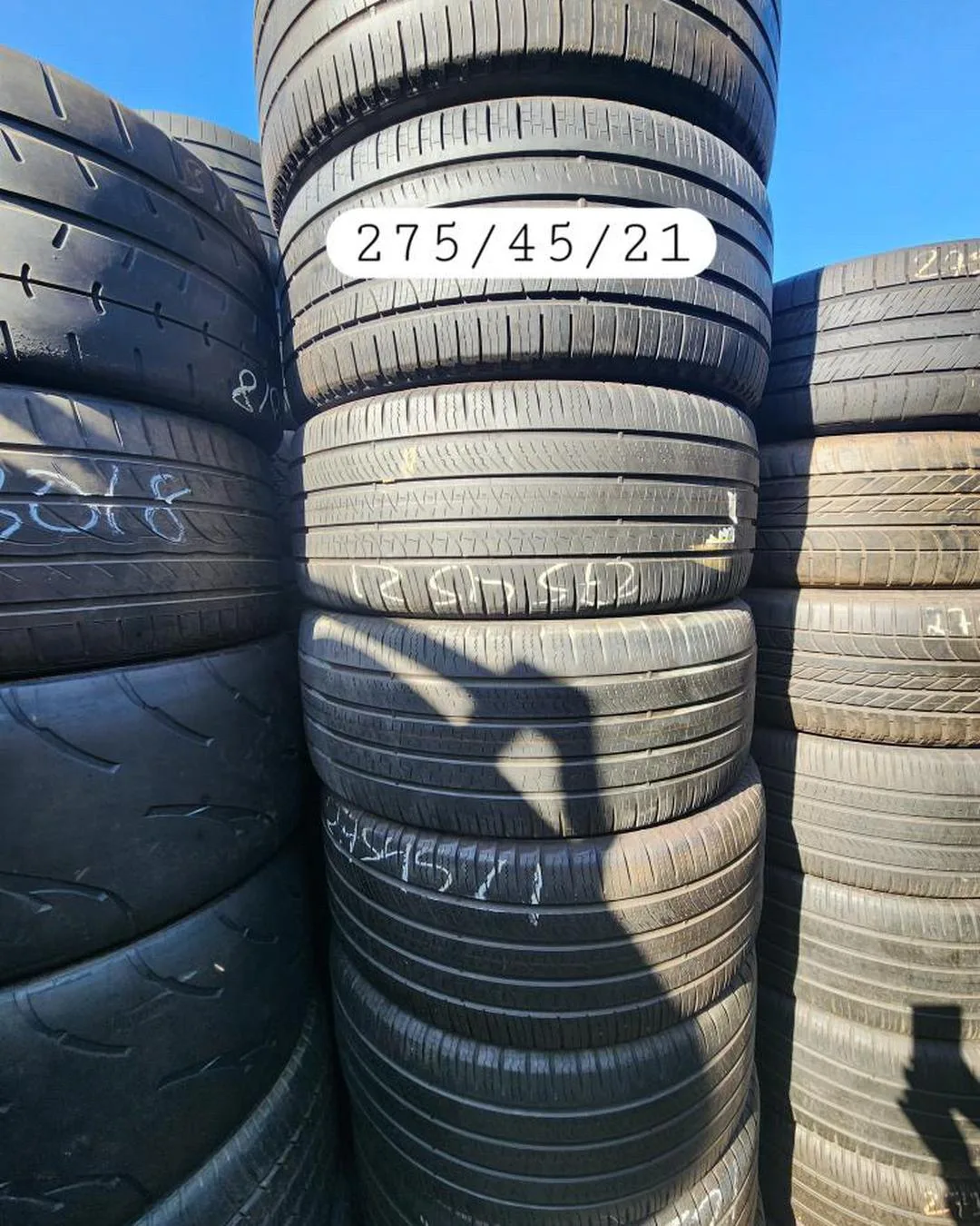 Used tire stack marked 275/45/21